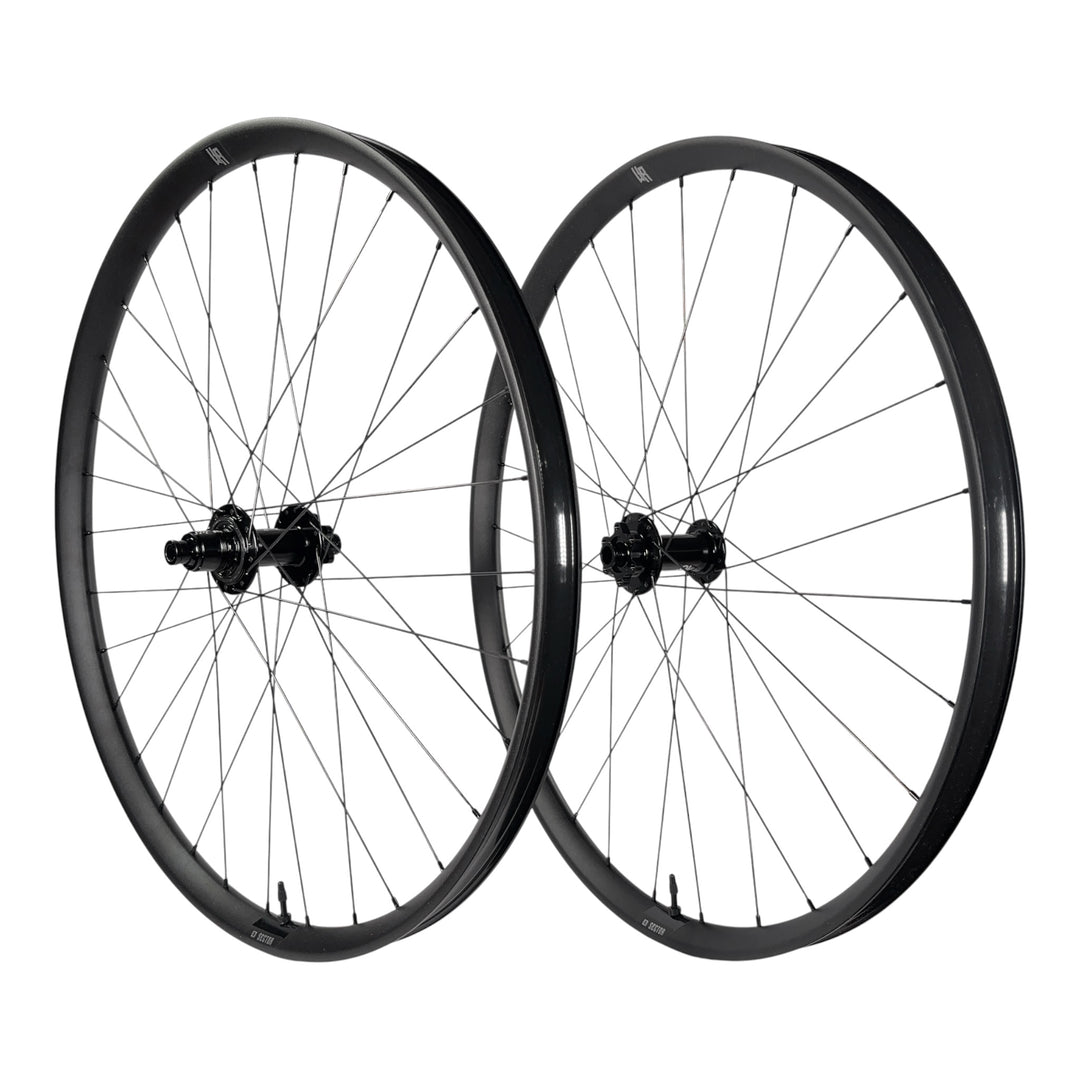 Black mountain bike wheelset with sleek rims and durable spokes for trail riding