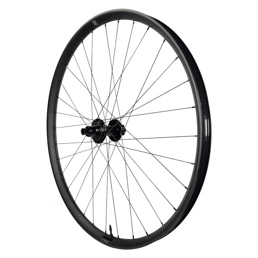 Black mountain bike wheel with Sector hub and sleek rim design for trail riding