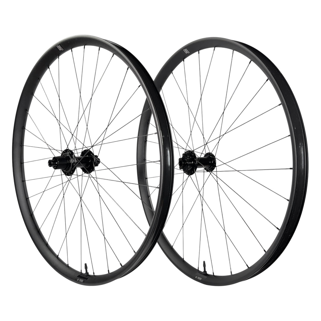 Black mountain bike wheelset with sleek rims and durable spokes for trail riding