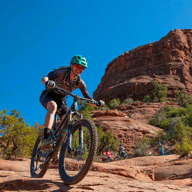 mountain bike rider going downhill Sedona slickrock